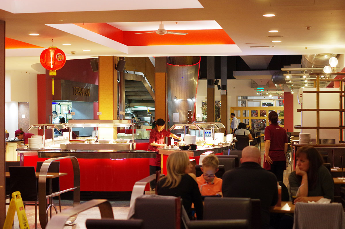 View of the buffet and seating area inside Aroma restaurant